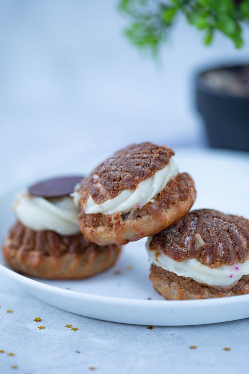 Photo of Cakes with Cream on a White Plate