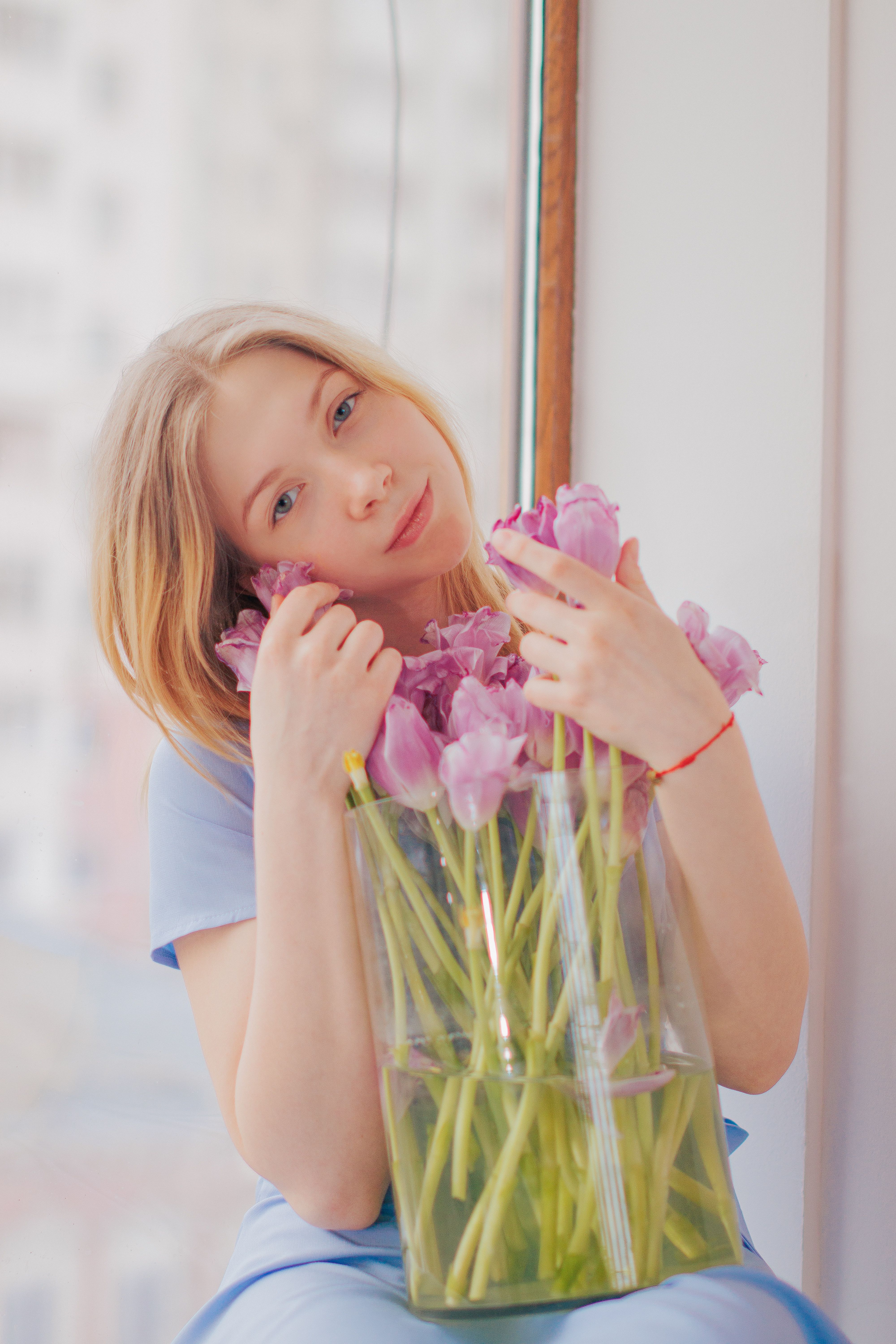Portrait of a Woman with a Bouquet of Flowers · Free Stock Photo