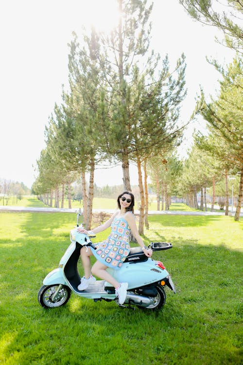 Woman Sitting on the Scooter 