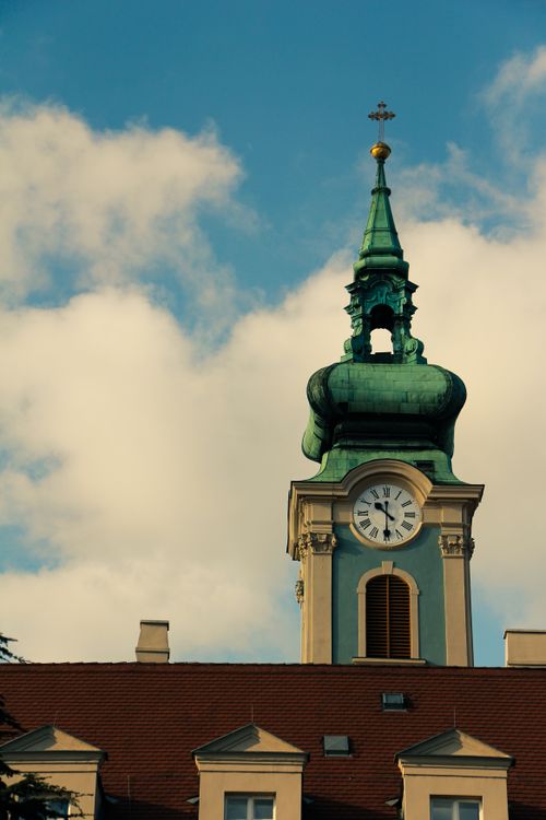 Free Architectural clock tower in Budapest captured under a clear blue sky. Perfect for cityscape themes. Stock Photo