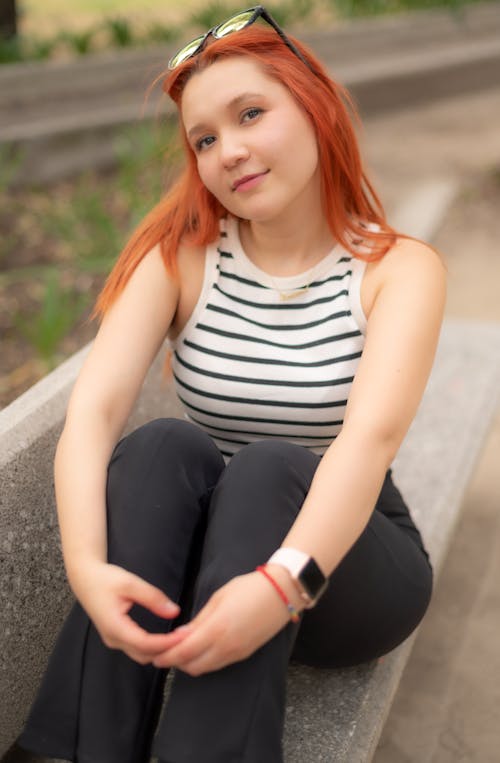 Redhead Woman Sitting on Bench