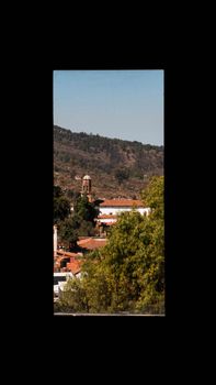 Discover the charming hillside town of Tzintzuntzan, Mexico, framed by lush greenery and historic architecture.