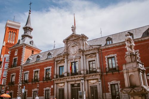 Free Low angle view of a historic building in Madrid, Spain with statues and classic architecture. Stock Photo