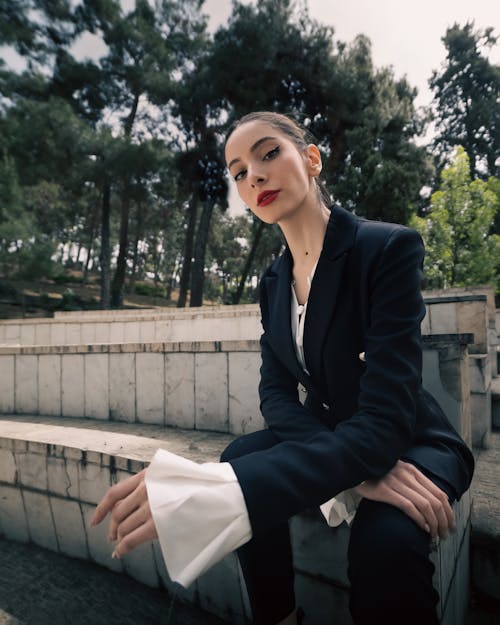 Woman in Suit Sitting