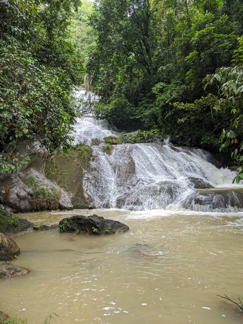 Free Explore the tranquil beauty of a cascading waterfall surrounded by lush greenery in Jawa Barat, Indonesia. Stock Photo