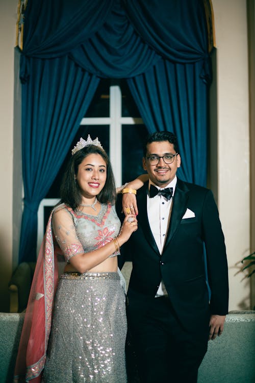 Smiling Woman with Man in Tuxedo