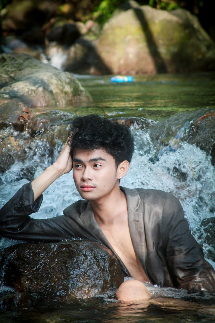 Man Posing In Splashing Water