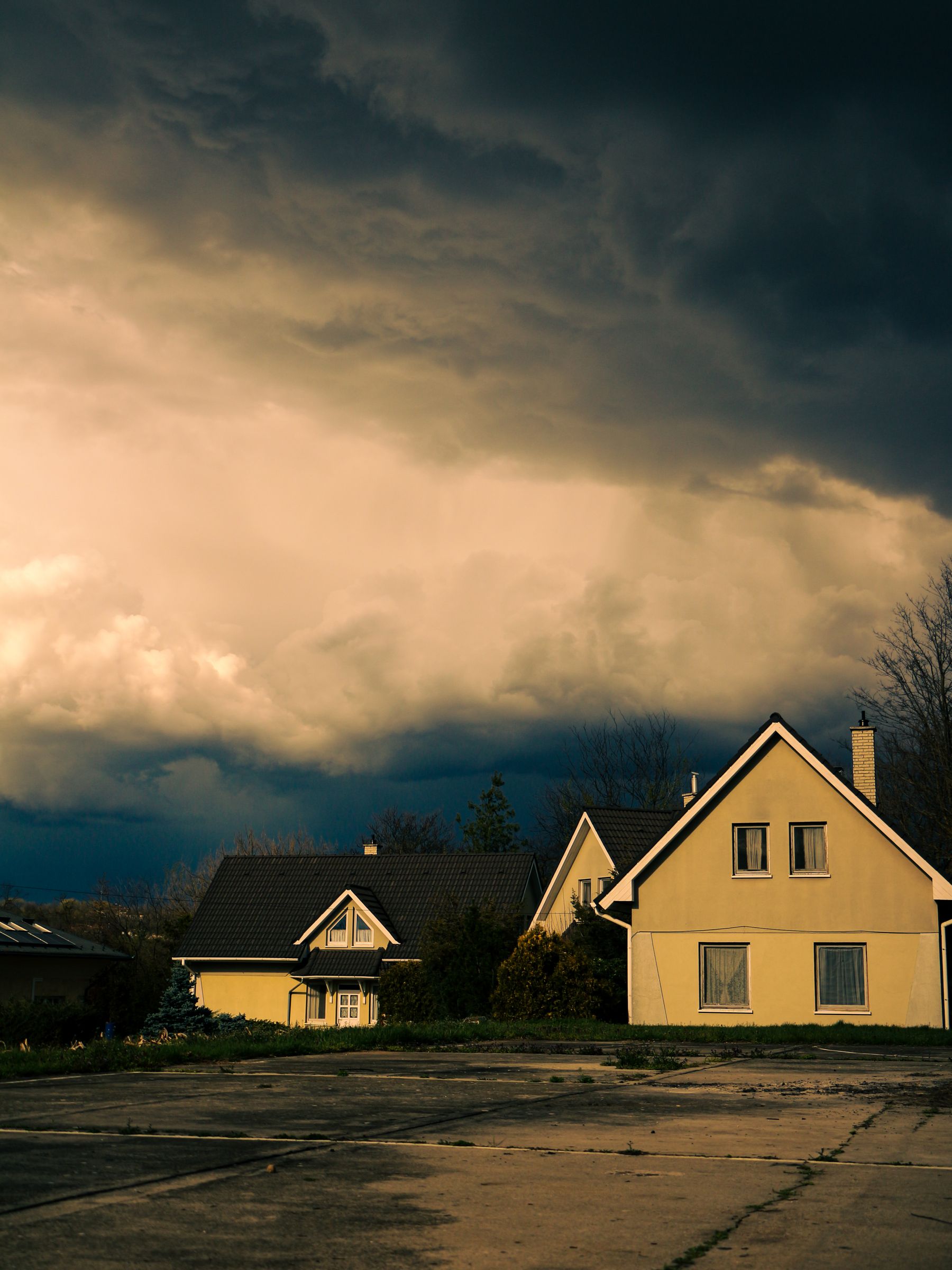 Dark storm clouds gathering over a house