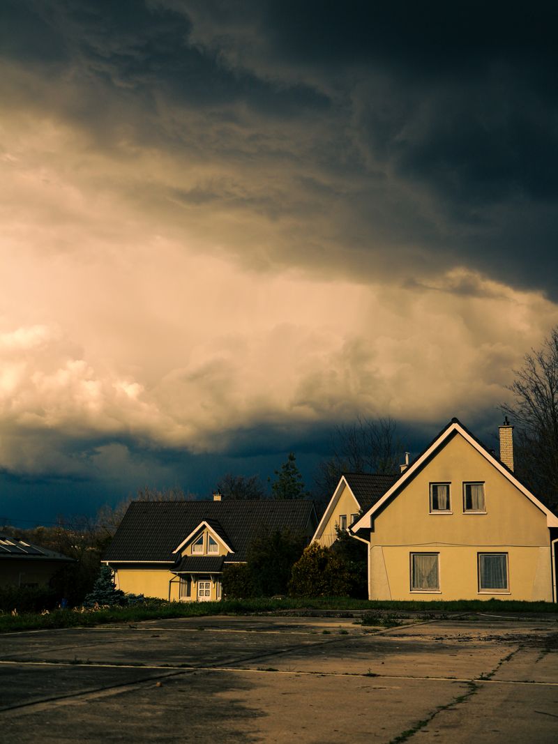 Dark storm clouds gathering over a house