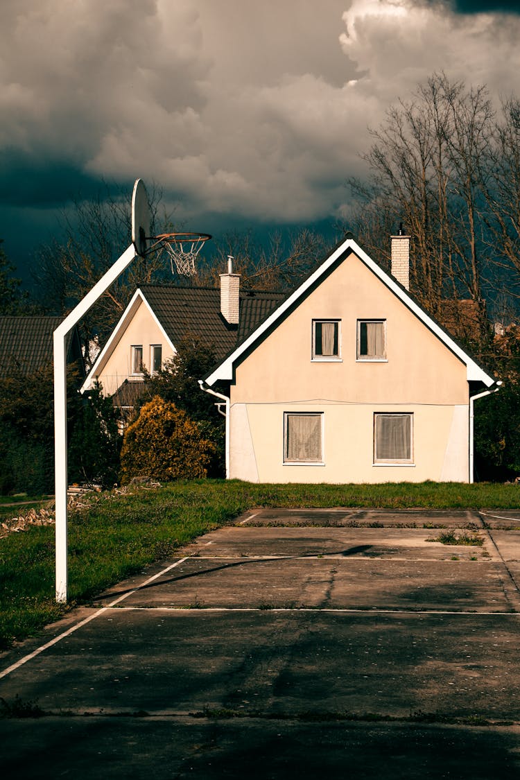 Basketball Court Near House In Village