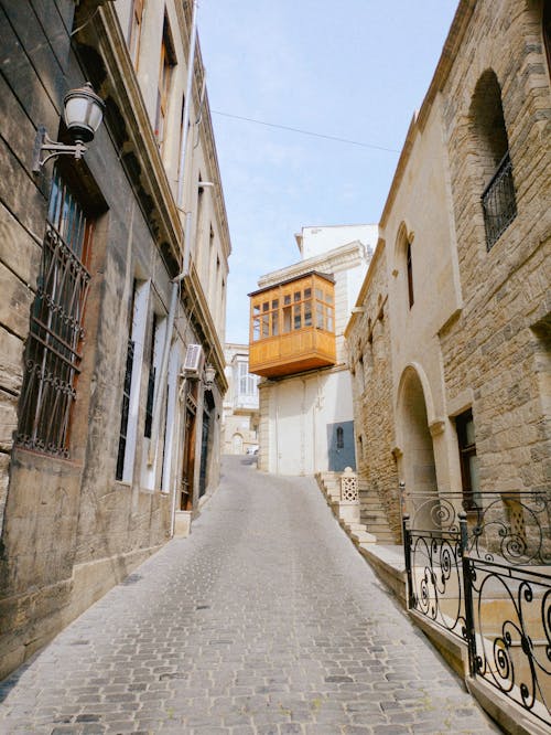 A Cobblestone Street between Traditional Buildings in Baku, Azerbaijan 