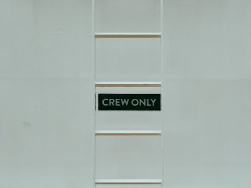 Crew Only Text on Board behind Ladder