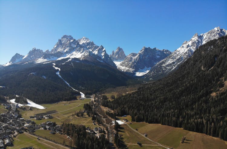 Green Valley And Forest On Hills In Mountains