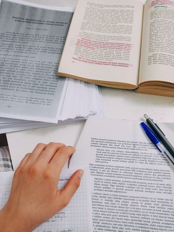 Paper And Notes Hands on Papers and Notes near Book · Free Stock Photo