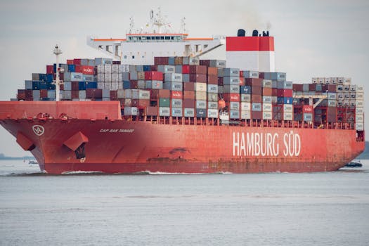 Cargo ship 'Hamburg Süd' loaded with containers navigating waters at Terneuzen in the Netherlands.
