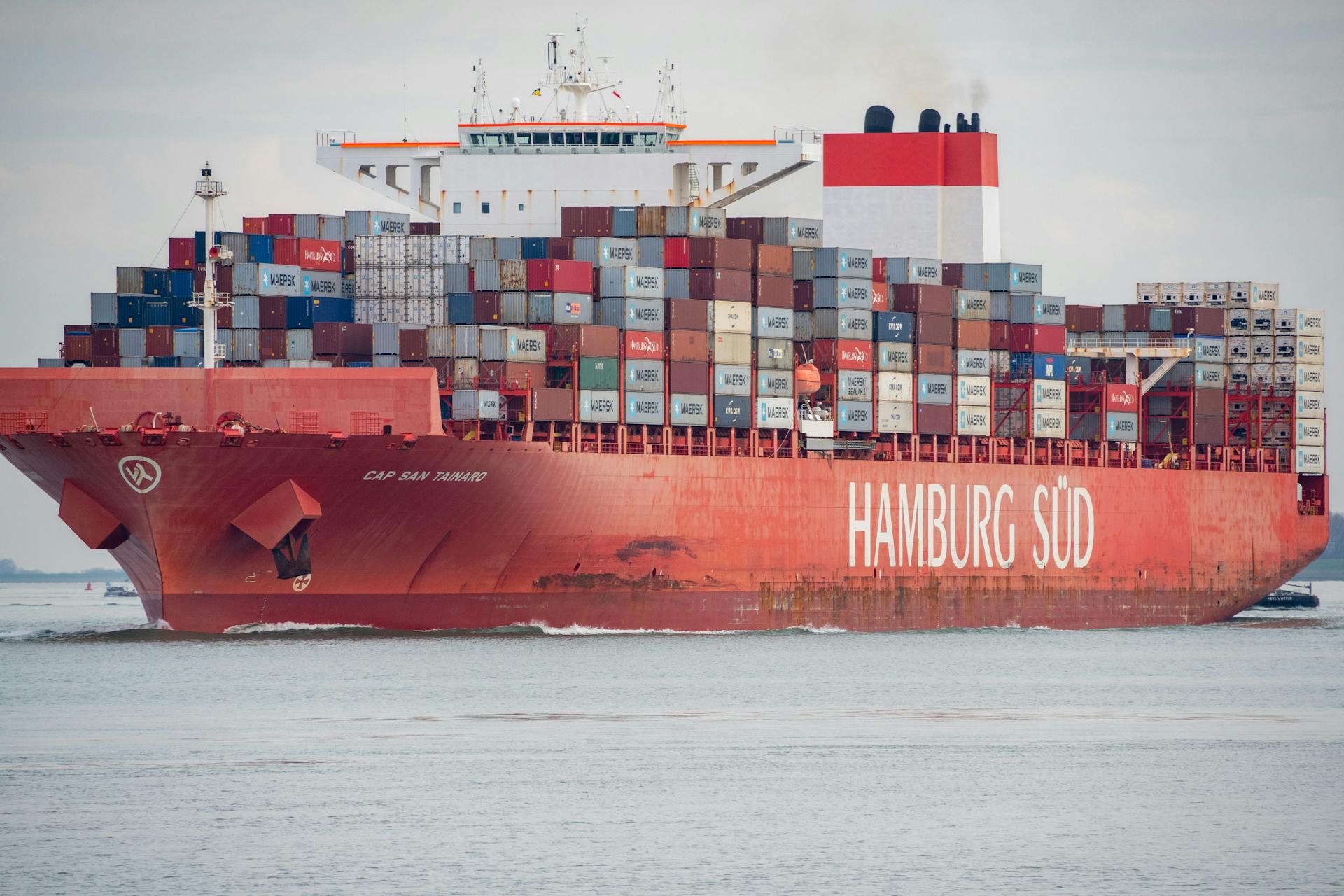 Cargo ship 'Hamburg Süd' loaded with containers navigating waters at Terneuzen in the Netherlands.