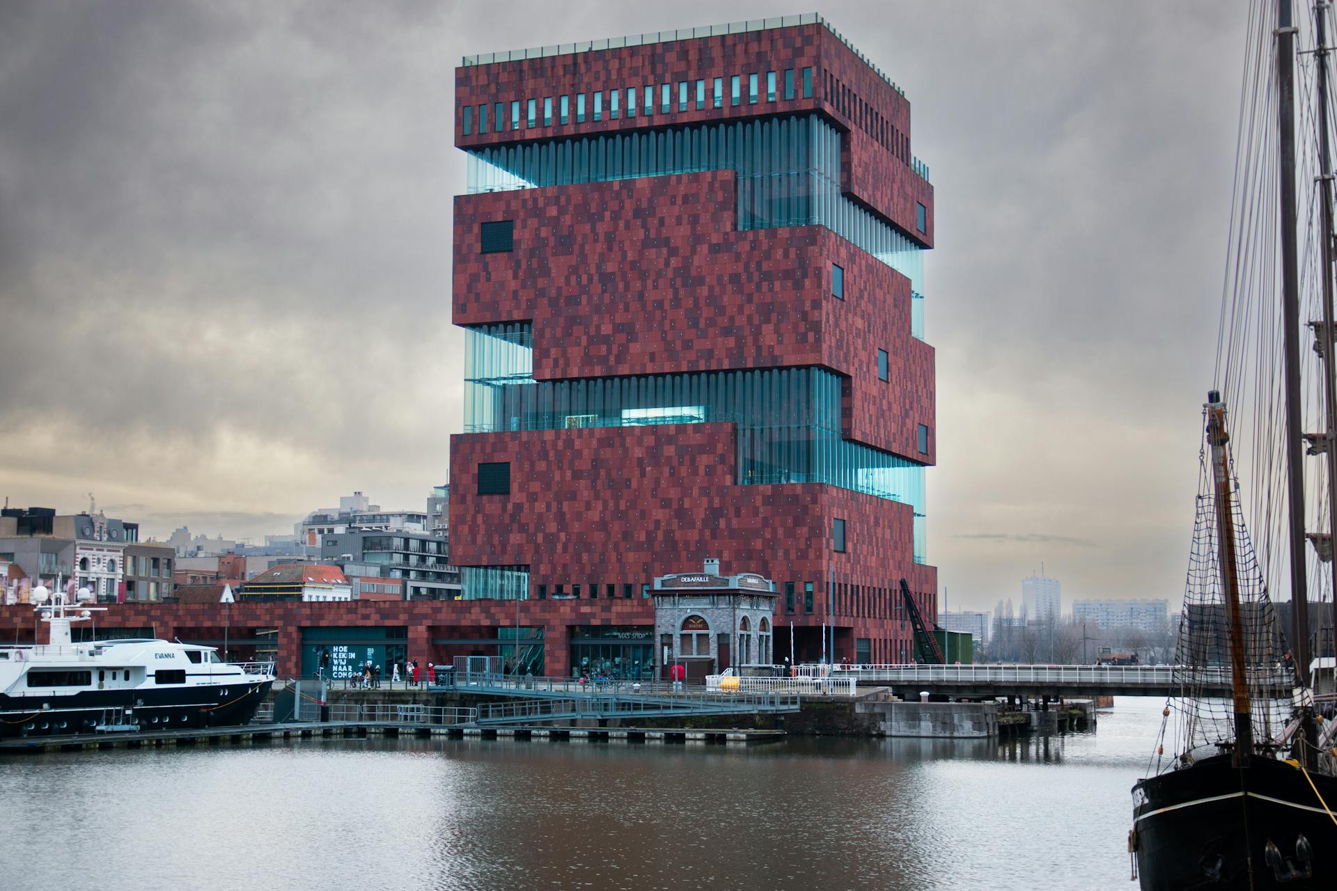 Modern red brick and glass building of Museum aan de Stroom in Antwerp.