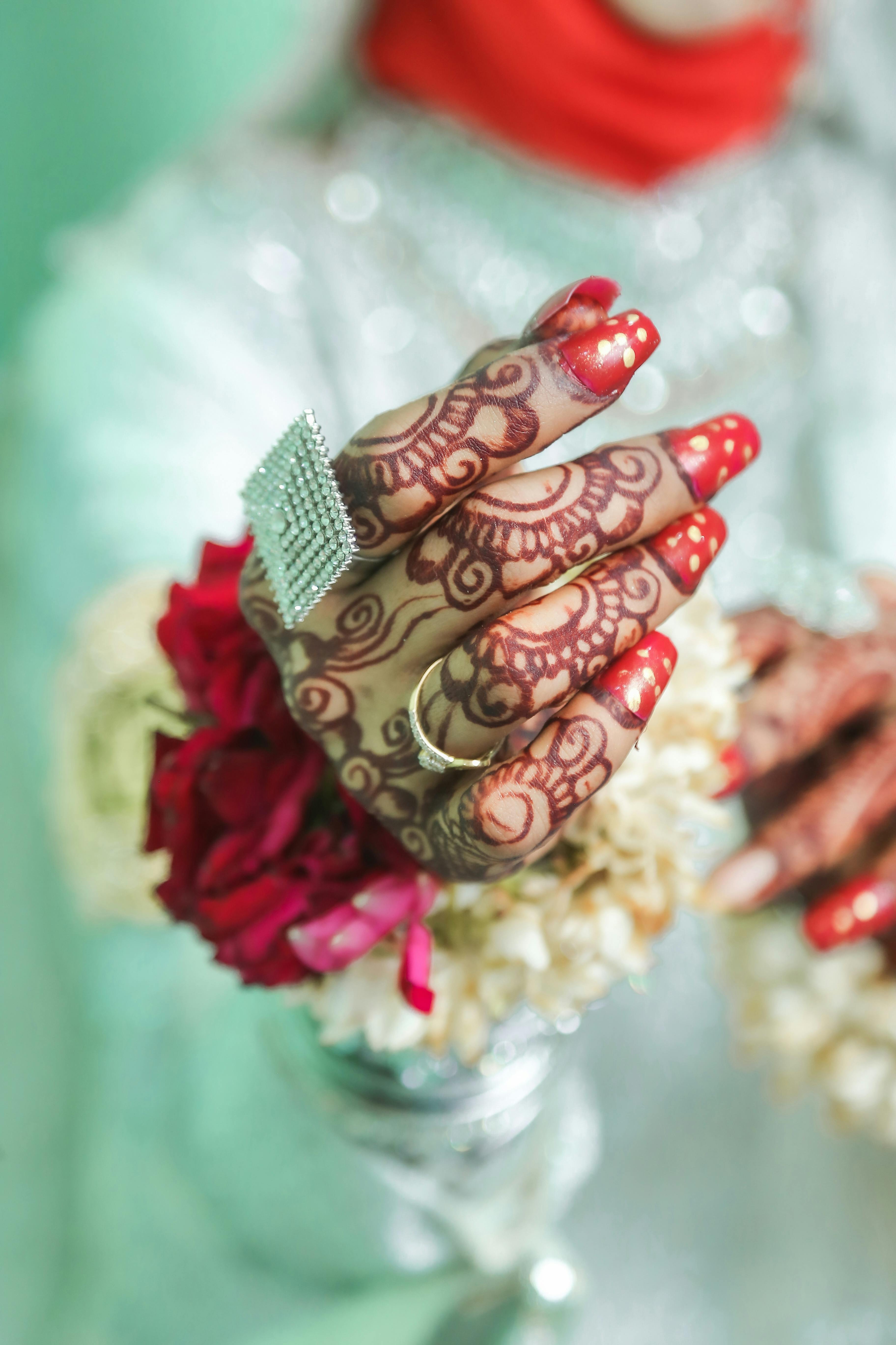 A Smiling Woman with Henna on her Hands · Free Stock Photo