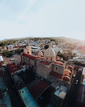 Stunning aerial shot of Tequisquiapan Cathedral and surrounding landscape in Mexico at day.