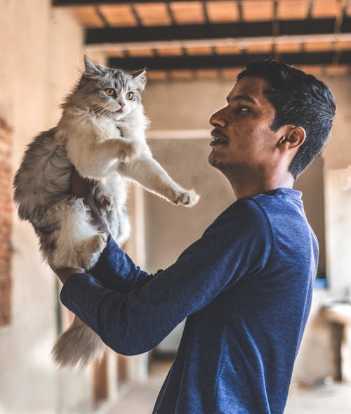 Man Holding Cat
