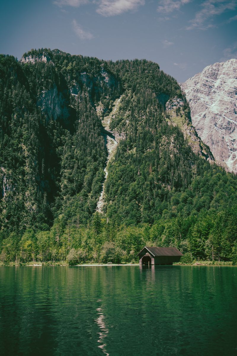 Emerald Lake Königssee and St. Bartholomä church on a Königssee day trip from Munich.