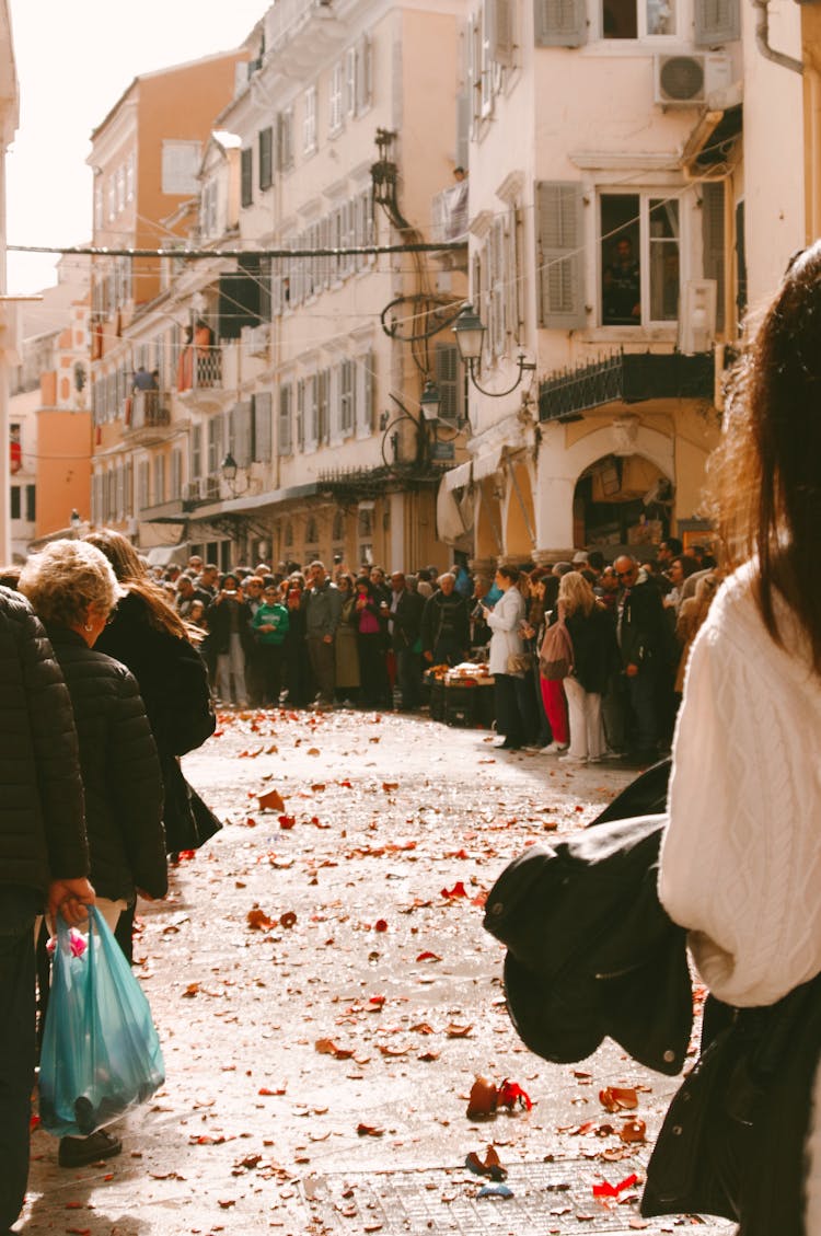 Crowd Of People Standing On The Street