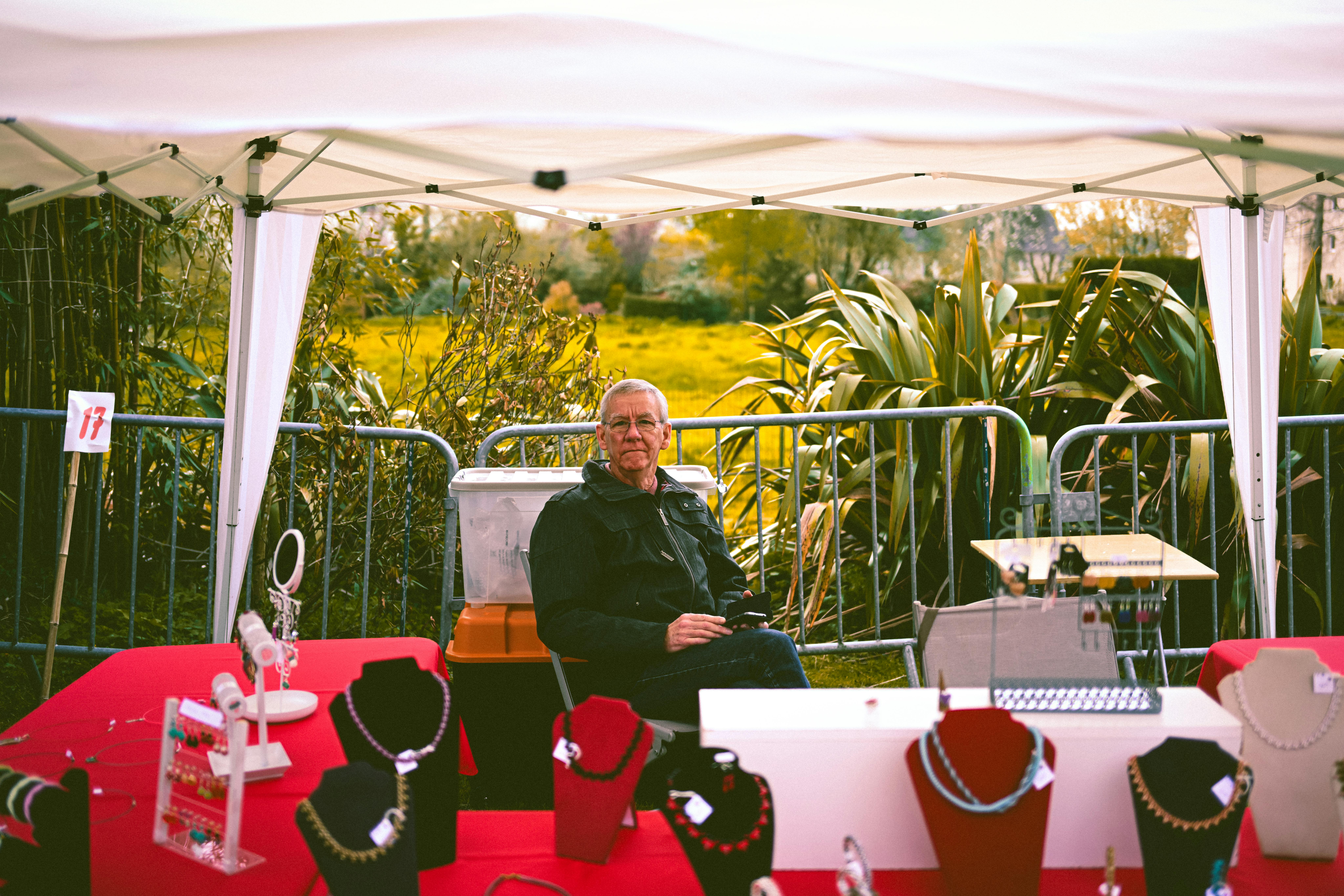 Marketing professional selects a marketing booth design in Hyderabad cityscape