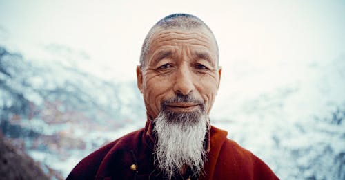 Man with Gray Beard in Mountains