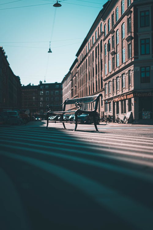 A Bench on the Street on the Background of a Traditional Building 