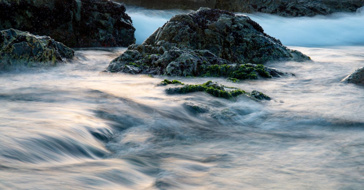 Water around Rocks on Sea Shore · Free Stock Photo