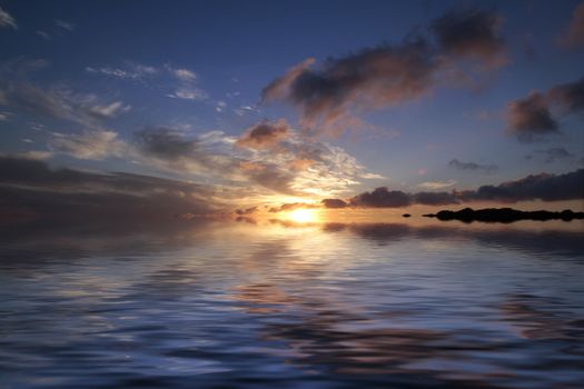 Serene sunset over calm ocean with clouds reflecting on water surface.