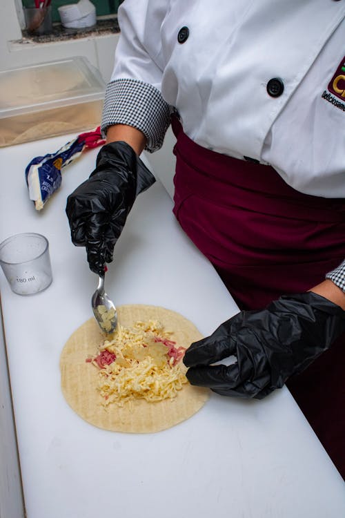 Hands of a Chef Preparing Food