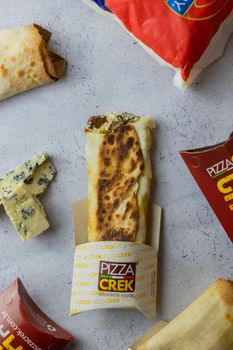 Tasty flatbread with blue cheese and wrap sandwiches, perfect for a gourmet experience.
