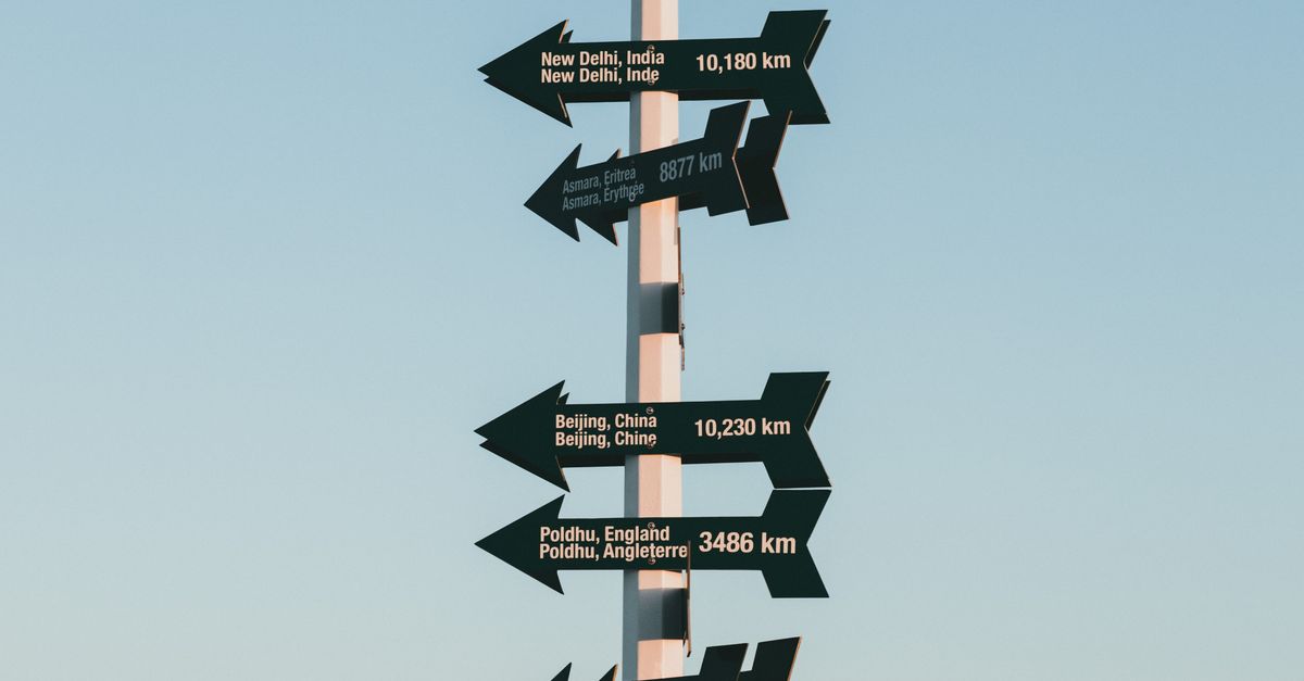 Directional Signs with Distance on Post · Free Stock Photo