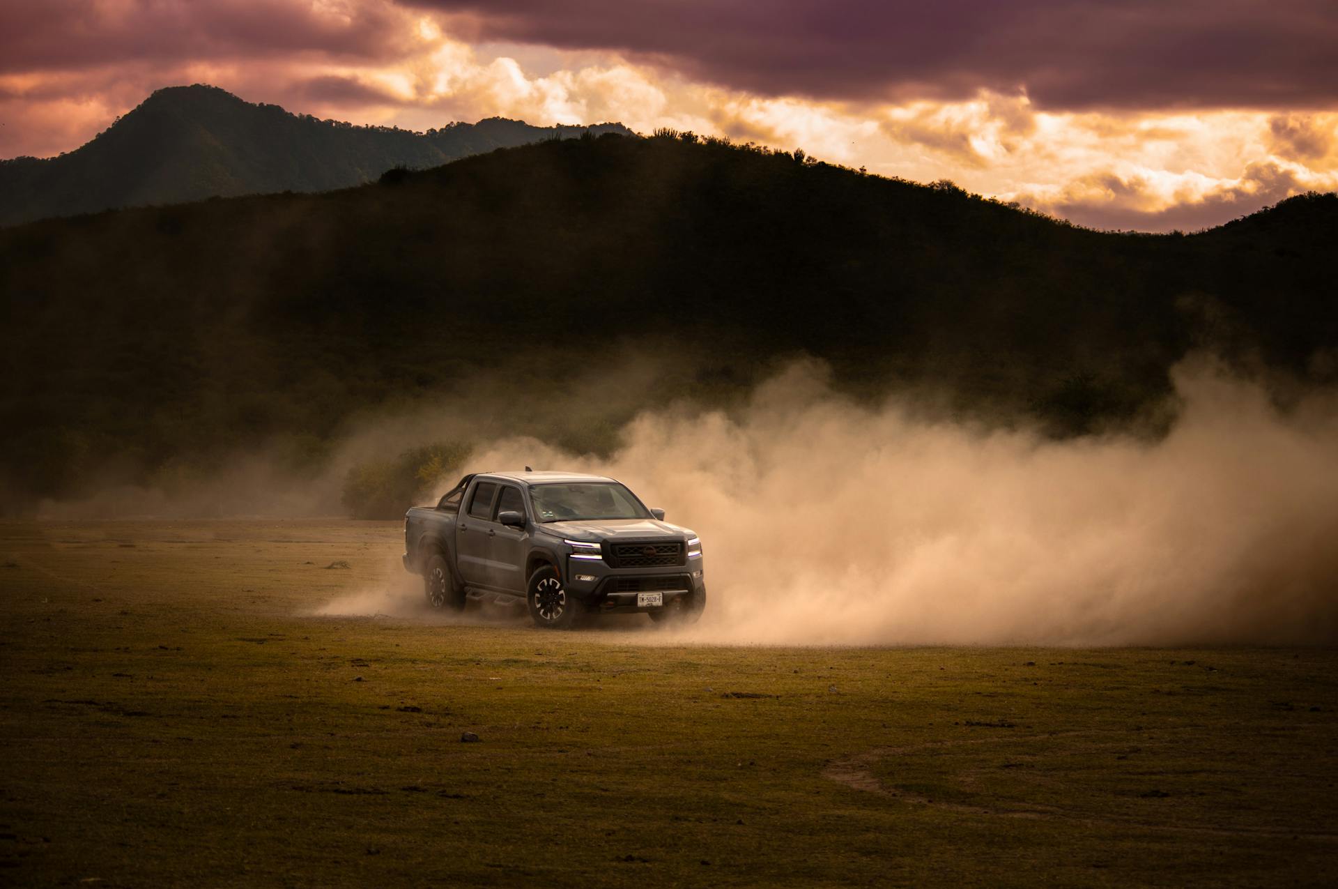 A Nissan Frontier Drifting in a Mountain Valley