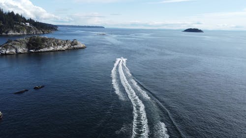 Aerial View of a Motorboat in a Bay 