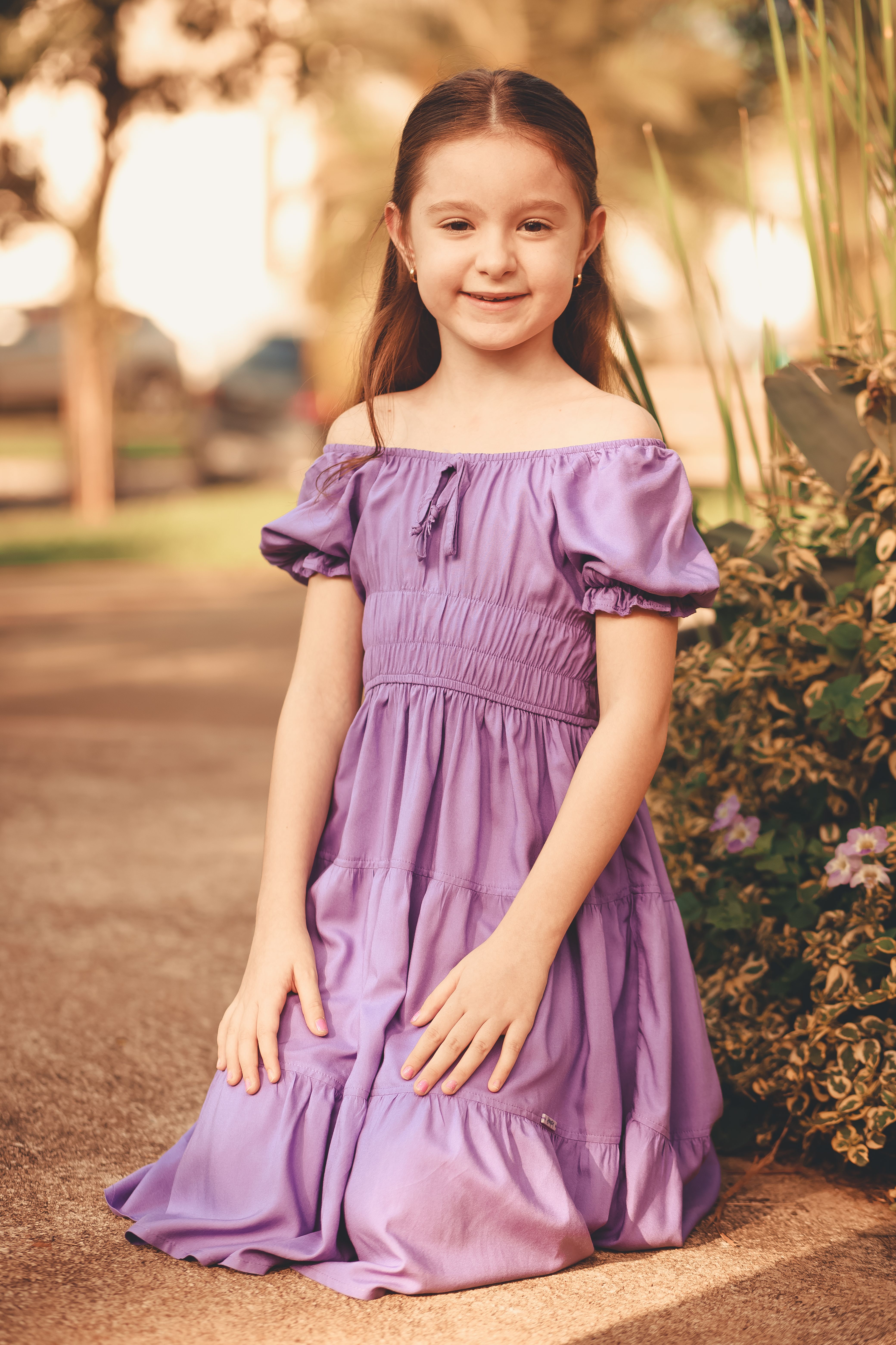 Girl in Purple Dress Kneeling · Free Stock Photo