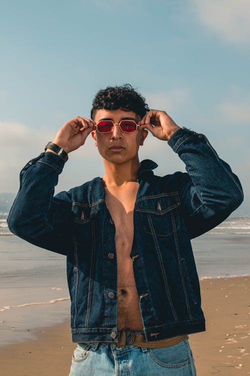 Man in Jean Jacket Posing on Beach