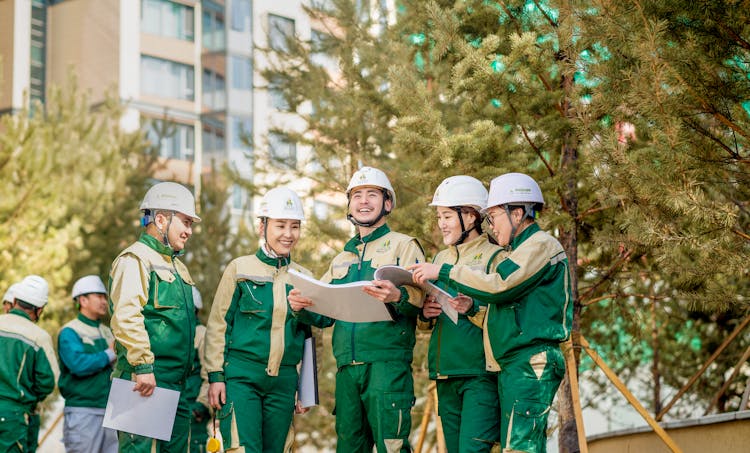 Smiling Engineers In Helmets