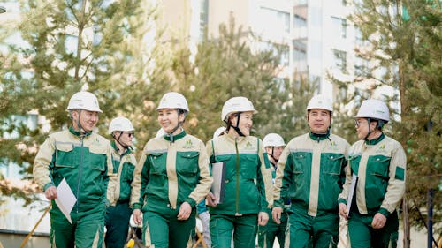 Construction Crew in White Hard Hats and Workwear