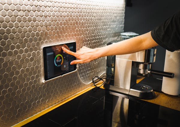 Smart home device setup on living room wall
