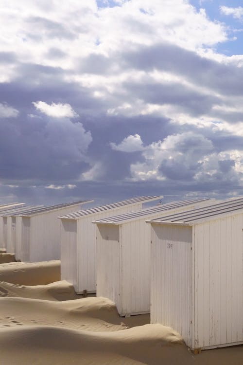 Row of White Sheds on Beach