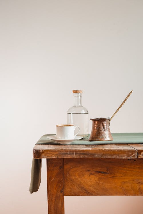 Still Life with Cup and Bottle on Table