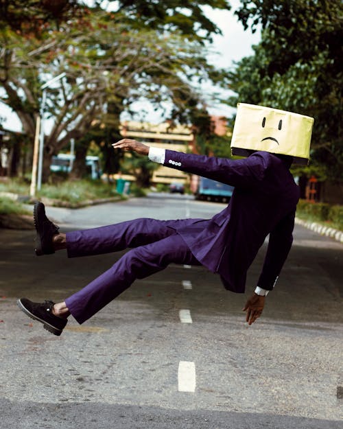 Model in Purple Suit with Unhappy Face Cardboard Box