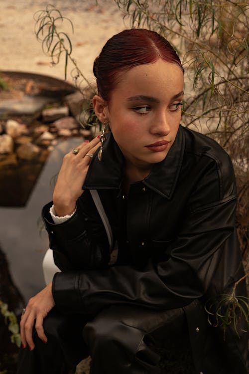 Woman Posing in Black Coat