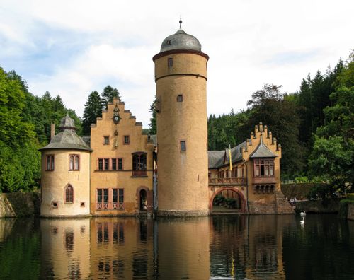 Scenic Mespelbrunn Castle surrounded by woodland in Bavaria
