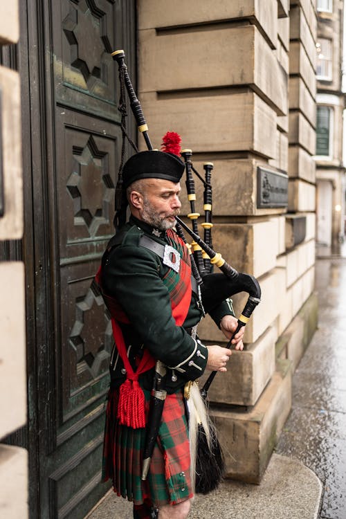 Bagpiper Playing on Sidewalk