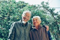 Smiling Man and Woman Wearing Jackets