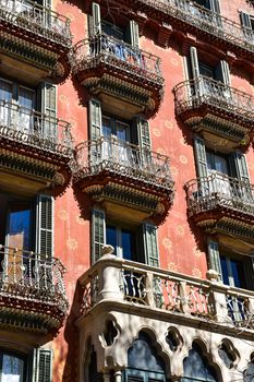 Detailed view of Casa Estape's ornate balconies in Barcelona, showcasing intricate architectural design.