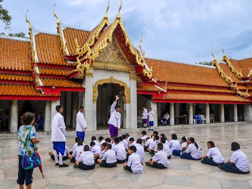 People and Children on Courtyard of Wat Benchamabophit Dusitwanaram Temple in Bangkok